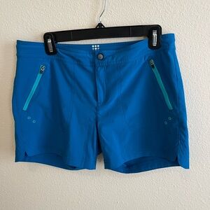 Women’s Title Nine Rogue water shorts, 5 inch inseam, turquoise blue, size 6.